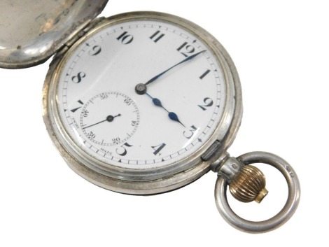 A Continental half hunter pocket watch, the engine turned case with blue enamel Arabic numerals, stamped to the reverse 925.