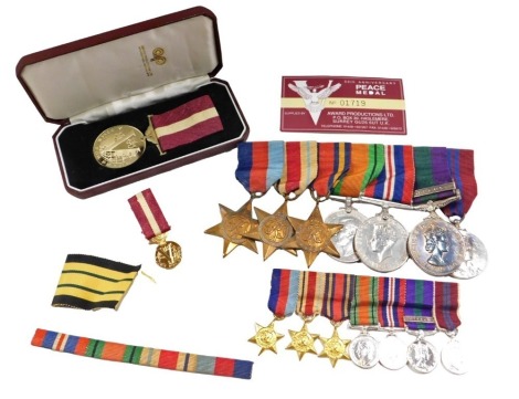 A group of WWII medals, The 1939-45 star, The Africa star, The Burma star, The Defence Medal, The 1939-45 Campaign medal, The Elizabeth II medal awarded to a 23233337 driver A Banister R.A.SC, and an Elizabeth II Coronation medal, sold with a full set of 