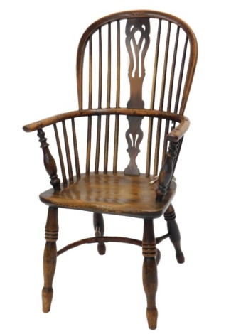 A 19thC yew, ash and elm high back windsor chair, with turned legs, and crinoline stretcher.