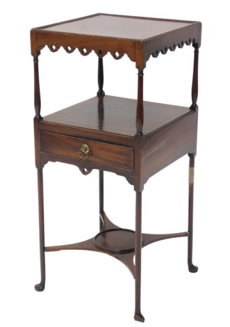 A George III mahogany washstand, the square top with a pierced frieze on turned supports, with drawer section and x shaped undertier, on pad feet, 75cm high, 33cm wide.