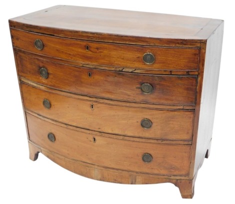 An early 19thC mahogany bow fronted chest, with an arrangement of four graduated drawers, each with circular brass handles, on bracket feet, 88cm high, 105cm wide.