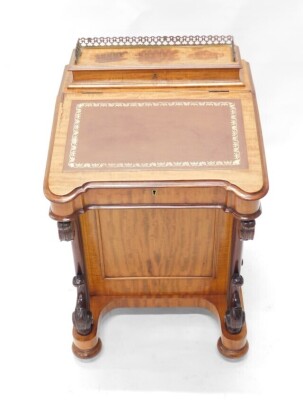 A Victorian mahogany Davenport, the top with a hinged pen and ink section, with pierced brass gallery, the fall with brown leather insert, enclosing a fitted interior, above an arrangement of four drawers to side, and four false drawers, on scrolling supp - 2