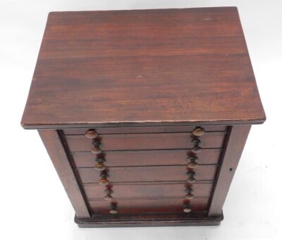 A Victorian stained pine Wellington chest, with an arrangement of six drawers, each with turned wood handles, and hinged retainer, on a plinth, 73cm high, 56cm wide. - 2