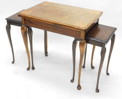 A 1920s burr walnut rectangular nest of three tables, the largest with fold over beige lined top, 56cm wide. - 3