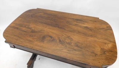 A William IV rosewood library table, the rectangular top with rounded ends, above a frieze drawer on tapering supports, united by turned stretcher, on paw feet, 72cm high, 112cm wide, 65cm deep. - 2