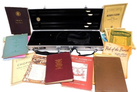 A steel hard cased music case, and various orchestral sheet music, to include guitar and violin. (a quantity)