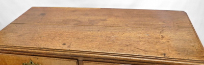 A George III oak chest of drawers, top with a moulded edge with two short and three long drawers, with pierced brass handles, on bracket feet, 113cm high, 107cm wide, 52cm deep. - 2