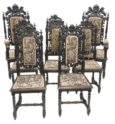 A set of eight late 19th/early 20thC ebonised oak dining chairs, in Caroleon style, each with a high leaf carved back, a padded seat, on fluted turned supports, with H stretcher, two with arms.