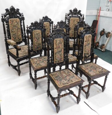 A set of eight late 19th/early 20thC ebonised oak dining chairs, in Caroleon style, each with a high leaf carved back, a padded seat, on fluted turned supports, with H stretcher, two with arms. - 2