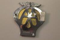 An AA motorcycle badge no. 68448Z.