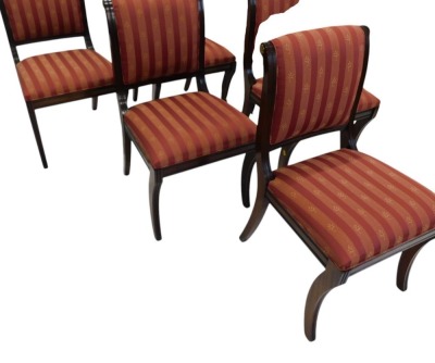 A reproduction mahogany dining table, the circular cross banded top on a turned column and four splayed legs with brass castors, 75cm high, 136cm diameter, and a set of six regency style dining chairs, with padded back and seat, on sabre legs. - 7