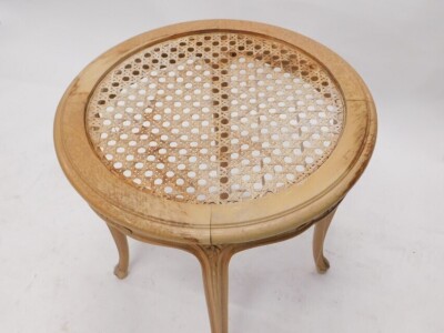 A Continental pale beech occasional table, the circular top with a cane and glass insert, the frieze carved with flowers on cabriole legs, 62cm high, 60cm diameter. - 2