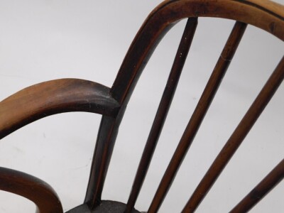 A pair of 19thC yew and elm Windsor armchairs, each with a spindle turned back, solid seat and turned legs with crinoline stretcher. (AF) - 4