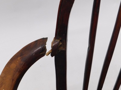 A pair of 19thC yew and elm Windsor armchairs, each with a spindle turned back, solid seat and turned legs with crinoline stretcher. (AF) - 6