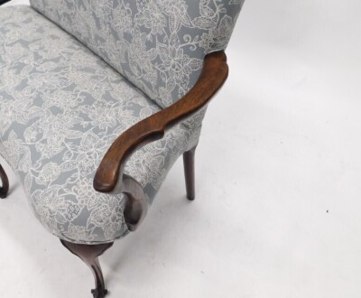 A mahogany sofa, in George III style, with a shaped back and seat upholstered in grey floral fabric, shepherd's crook shaped arms, on scroll carved cabriole legs, 119cm wide. - 3