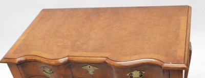 A Titchmarsh and Goodwin burr walnut and walnut lowboy or side table, the rectangular top with a moulded edge, and a serpentine front above a frieze drawer with engraved brass handles, on cabriole legs with pointed pad feet, 77cm wide. - 2