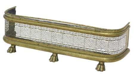 A 19thC brass fire curb or fender, with a pierced grill, on pad feet, 96cm wide.