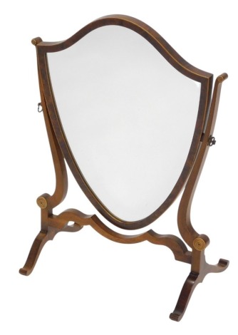 A walnut shield shaped dressing table mirror, on splayed legs, 41cm wide.