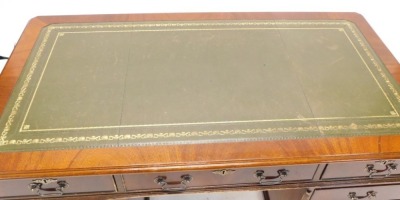 A mahogany pedestal desk, the rectangular top with a green leather inset above nine drawers, on bracket feet, 79cm high, 137cm wide, 77cm deep. - 2