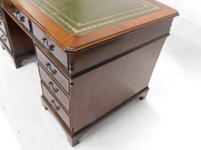 A mahogany pedestal desk, the rectangular top with a green leather inset above nine drawers, on bracket feet, 79cm high, 137cm wide, 77cm deep. - 3