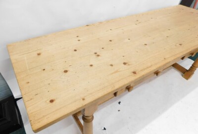 A large pine refectory table, the rectangular planked top on turned supports with low H stretcher, 78cm high, 246cm wide, 82.5cm deep. - 3