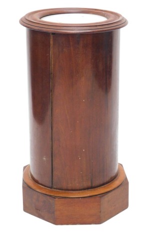 A Victorian mahogany cylindrical pot cupboard, the moulded top with a white marble insert above a door, on octagonal plinth, 74cm high, 38cm wide.