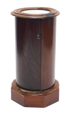 A Victorian mahogany cylindrical pot cupboard, the circular moulded top with a white marble insert above a door, on octagonal base, 74cm high, 38cm diameter. (AF)