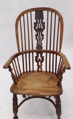 A 19thC yew ash and elm Windsor chair, with a pierced splat, spindle turned supports, and a solid seat, on turned legs with crinoline stretcher. - 2