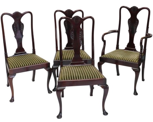 A set of five mahogany dining chairs in Queen Anne style, each with shell carved solid splat, drop in seat, on cabriole legs with pad feet.