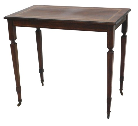 A rosewood and satinwood cross banded low table, the rectangular top with a moulded edge, on square tapering legs with brass castors, 66cm high, 76cm wide.