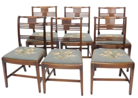 A set of six early 19thC mahogany and boxwood strung dining chairs, each with a bar back and drop in seat, on square tapering legs.