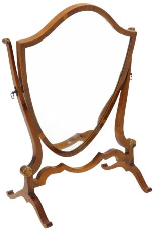 A yew shield shaped dressing table mirror, on splayed legs, 38cm wide.