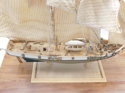 A scratch built model of a two masted sailing ship, on rectangular base, 88cm long. - 2