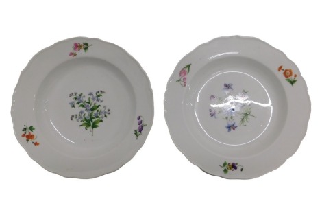 Two 19thC Meissen porcelain shallow wavy edge soup bowls, decorated with summer flowers, underglaze blue painted mark, 23cm dia. (AF) NB. This lot will be sold for BBC Children In Need by guest novice auctioneers that have supported the BBC Bargain Hunt 2