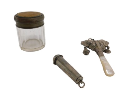 A George V silver child's rattle, in the form of a butterfly, with mother of pearl teether handle, Birmingham 1928, 10cm long. (AF), a silver cheroot holder, Birmingham 1919 and faceted crystal jar with a printed hunting scene to the cover. (3) NB. This l