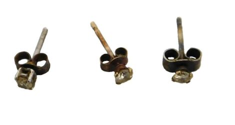 A pair of diamond single stone ear studs, and a further single stud.