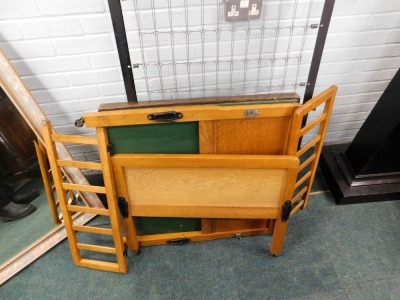 A pine framed child's bed, card table, and a wall mirror. - 2