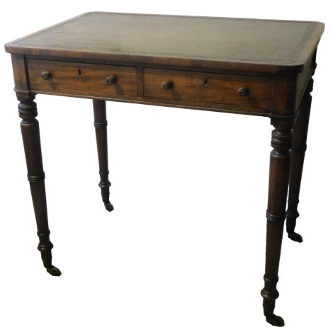 A George IV mahogany small writing table, the rectangular top with a leather inset and rounded corners, above two frieze drawers, on turned legs with brass castors, in the manner of Gillows.