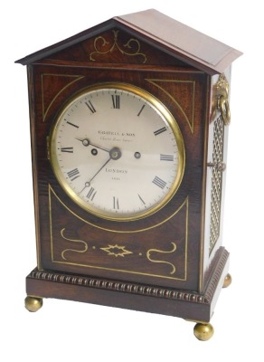 A Regency rosewood and brass inlaid mantel clock, the silvered dial stamped Gravell & Sons London No.4016, on bun feet, 37cm high. Provenance: Purchased from Rafferty & Woolwin (?) 10 years ago for £6,500.