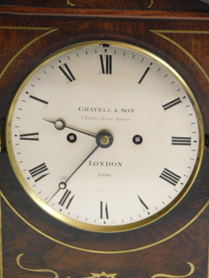 A Regency rosewood and brass inlaid mantel clock, the silvered dial stamped Gravell & Sons London No.4016, on bun feet, 37cm high. Provenance: Purchased from Rafferty & Woolwin (?) 10 years ago for £6,500. - 2