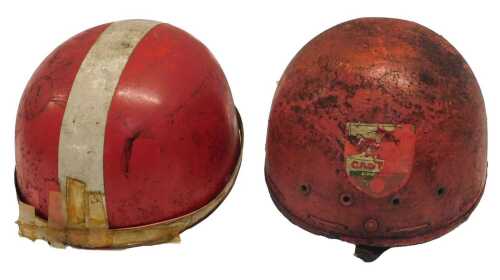 Two Pudding Basin helmets, one with a Castrol sticker. (AF)