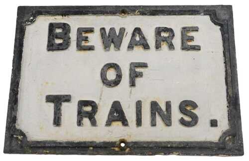 A cast iron Beware of the Trains sign, 39cm x 57cm.