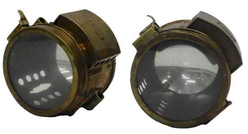 A pair of Paralite acetylene head lamps.