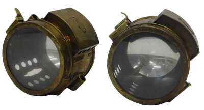 A pair of Paralite acetylene head lamps.