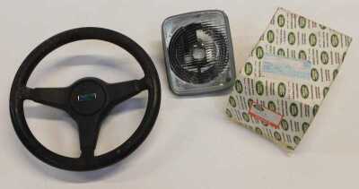 An Austin steering wheel, and a Land Rover 1XSTC766 head lamp assembly left hand. (2) - 2