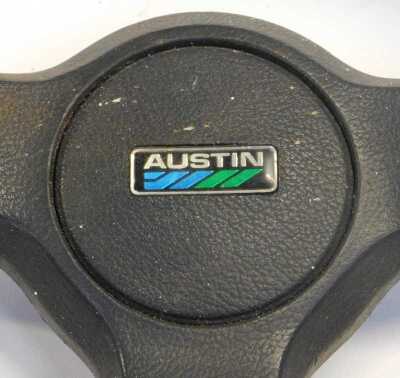 An Austin steering wheel, and a Land Rover 1XSTC766 head lamp assembly left hand. (2) - 3