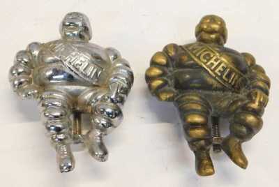 Various car mascots, including a brass Michelin man, chrome Michelin man, an Art Deco style eagle mascot, a Fred Astaire and Ginger Rogers dancing car mascot, etc. (1 tray) - 4