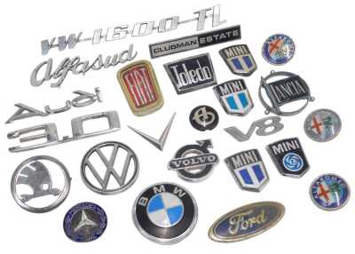 Various car badges, including Skoda, BMW, VW, Lancia, Mini, Volvo, etc. (1 tray)