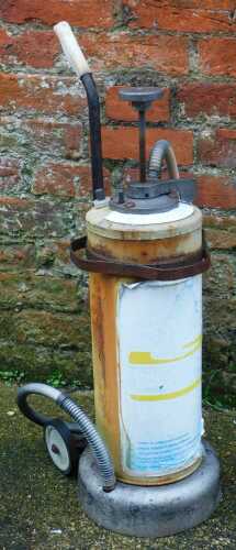 A Duckhams two stroke oil dispenser, 76cm high.