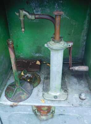 An oil pump cabinet, in green, bearing plaque for The Property of CC Wakefield and Co Ltd 46 Grosvenor Street London W1, 161cm high. - 2